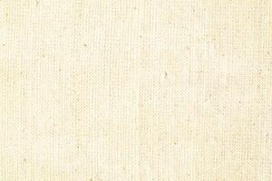 Natural linen material textile canvas Fabric texture background Close-up detail of fabric natural color Hemp material pattern design wallpaper. can be used as background or for graphic design photo