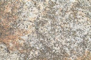 Abstract natural rock stone granite grunge rusty metal texture design background natural color stone material granite design wallpaper. Close-up detail of natural stone photo