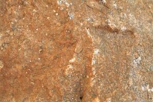 Abstract natural rock stone granite grunge rusty metal texture design background natural color stone material granite design wallpaper. Close-up detail of natural stone photo