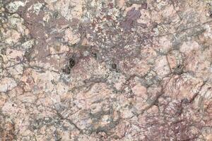 Abstract natural rock stone granite grunge rusty metal texture design background natural color stone material granite design wallpaper. Close-up detail of natural stone photo