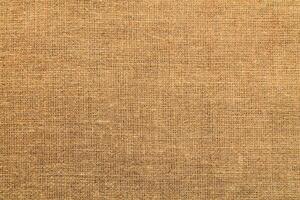 Natural linen material textile canvas Fabric texture background Close-up detail of fabric natural color Hemp material pattern design wallpaper. can be used as background or for graphic design photo