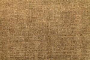 Natural linen material textile canvas Fabric texture background Close-up detail of fabric natural color Hemp material pattern design wallpaper. can be used as background or for graphic design photo