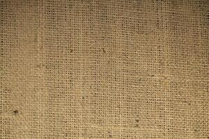Natural linen material textile canvas Fabric texture background Close-up detail of fabric natural color Hemp material pattern design wallpaper. can be used as background or for graphic design photo