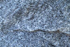 Abstract natural rock stone granite grunge rusty metal texture design background natural color stone material granite design wallpaper. Close-up detail of natural stone photo