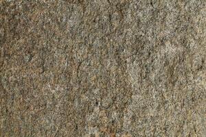 Abstract natural rock stone granite grunge rusty metal texture design background natural color stone material granite design wallpaper. Close-up detail of natural stone photo