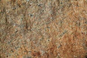 Abstract natural rock stone granite grunge rusty metal texture design background natural color stone material granite design wallpaper. Close-up detail of natural stone photo