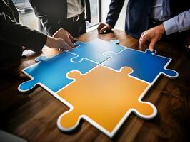 Business people joining puzzle pieces on wooden table photo