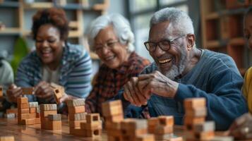 Diverse group of senior people playing with building blocks and smiling at the retirement home photo