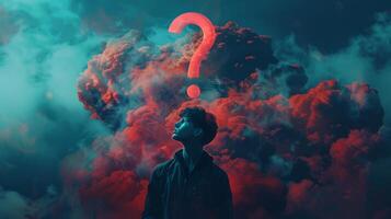 Contemplative man pondering life beneath a large red question mark in an atmospheric sky photo