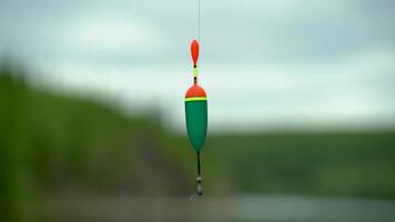 Close-up of a float with a weight on a fishing line video