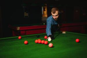 Playing billiard - Close-up shot of a man playing billiard photo