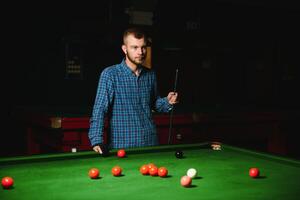 Playing billiard - Close-up shot of a man playing billiard photo
