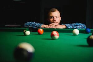 Playing billiard - Close-up shot of a man playing billiard photo