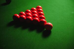 snooker balls on green surface, shallow depth of field photo