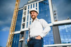 A construction worker control in the construction of roof structures on construction site and sunset background photo