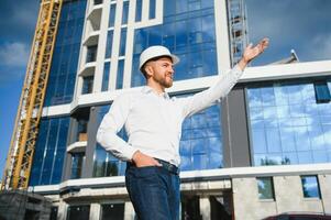 Industrial theme constructor standing at a site area. photo