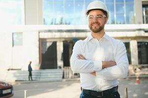 construction worker or architect in construction site outdoors with Hot weather sunny . builder in hard hat inspecting and working in workplace photo