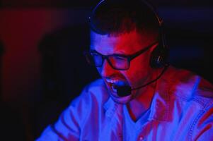 Gamer playing a first person shooter on high end pc. photo