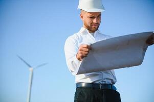 Power engineer are working with wind turbines. photo