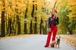 woman with dog walking in the park photo
