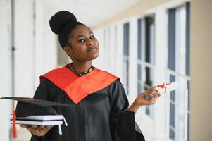 beautiful african female student with graduation certificate photo