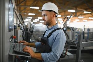 Factory worker. Man working on the production line. photo