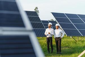 Project manager discuss with worker installation process of solar panel photo