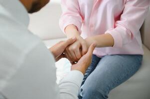 close-up of a female doctor's hands hugging the patient's hands. A gesture of support. Psychological assistance to a woman photo