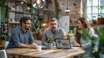 Three Professionals Collaborating During a Business Meeting in a Modern Office photo
