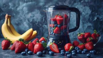 Fresh Strawberries, Blueberries, and Bananas in a Blender on a Blue Countertop photo