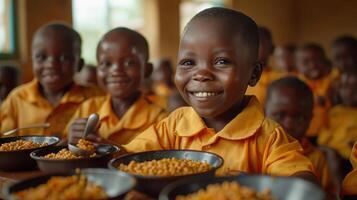 Smiling African Schoolchild Eating Lunch in Classroom photo