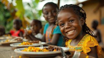 Smiling Girl Eating a Meal With Friends in Rural Africa photo