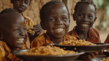 Smiling Children Enjoying a Meal of Rice and Vegetables in Africa photo