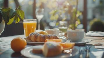 Sunny Morning Breakfast With Croissants, Orange Slices, and Coffee on a Patio Table photo