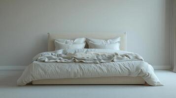 Cozy Modern Bed With Soft Bedding In Bright Room Featuring Neutral Tones And Plush Pillows During Daylight Hours. photo