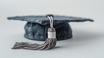 Unique Textile Graduation Cap Displayed Elegantly on a Clean Surface in Bright Lighting. photo