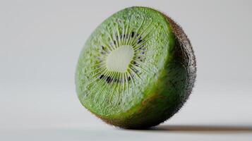 Vibrant Cross-Section of a Fresh Kiwi Fruit Displaying Its Lush Green Interior Under Natural Light. photo