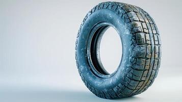 Exploring the Details of a Single Off-Road Tire Against a Minimalist White Background. photo