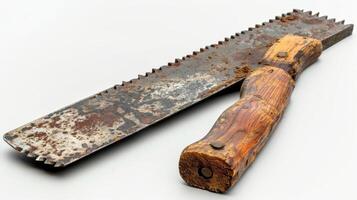 An Aged Hand Saw Resting on a Weathered Wooden Surface in a Rustic Workshop at Dusk. photo