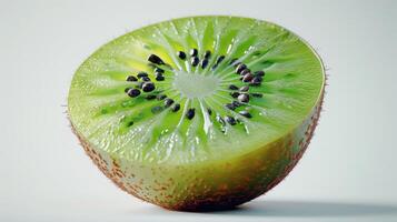 Freshly Cut Kiwi Fruit Revealing Green Flesh and Tiny Seeds on White Background. photo