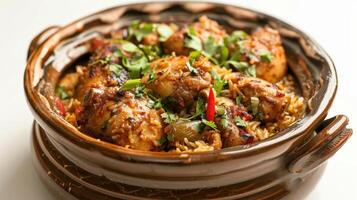 Deliciously Spiced Chicken Biryani Served in Traditional Clay Pot With Fresh Herbs. photo