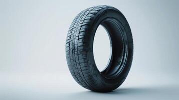 A Close-Up View of a Used Black Tire on a White Background in Bright Lighting. photo