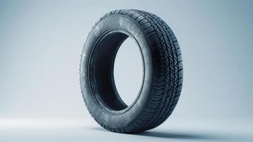 A Black Rubber Tire With Detailed Tread Pattern On A White Background Displayed Vertically. photo