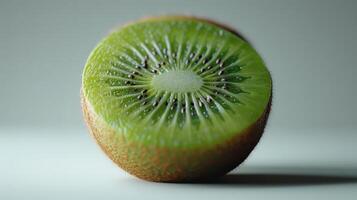 Freshly Sliced Kiwi Fruit Close-Up Displaying Vibrant Green Flesh and Unique Seed Patterns. photo