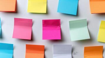 Colorful Sticky Notes Organized on a Bright Wall for Creative Ideas and Planning Activities photo
