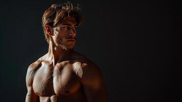 Strong and Defined Male Model Poses in Dramatic Lighting at Sunset Hour in Studio photo