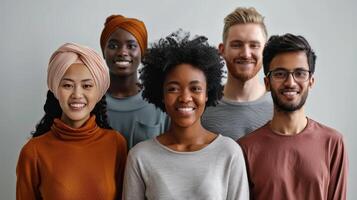 Diverse Group of Friends Smiling Together Against a Light Gray Background in a Cozy Indoor Setting photo