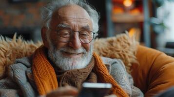 Joyful Elderly Man Enjoys Warm Moments While Using His Smartphone in Cozy Indoor Setting photo