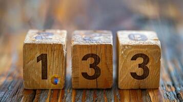 Wooden Blocks Displaying Numbers One and Three on Rustic Table Surface in Natural Light photo