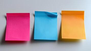 Brightly Colored Sticky Notes Resting on a Table Ready for Creative Ideas During a Productive Office Session photo